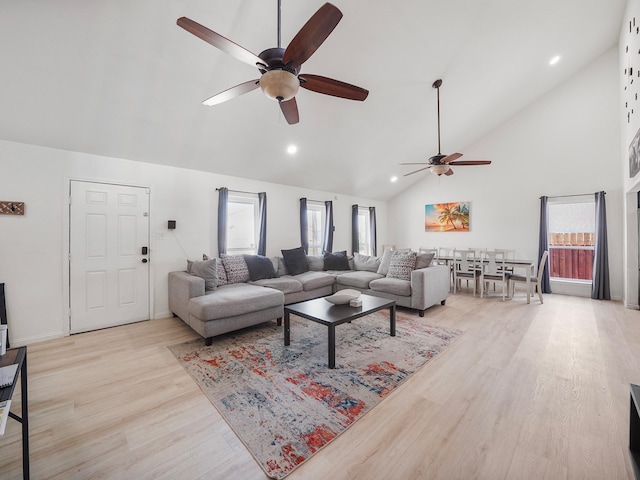 living room with ceiling fan, a healthy amount of sunlight, and light hardwood / wood-style floors