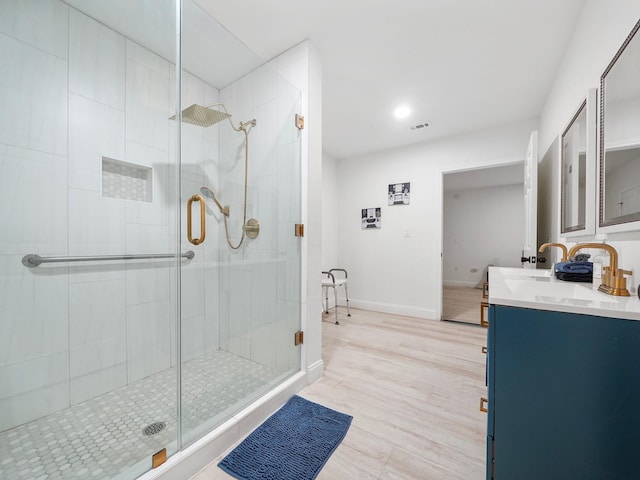 bathroom with vanity and walk in shower