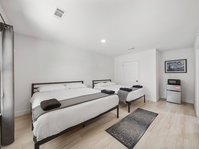 bedroom featuring light wood-type flooring