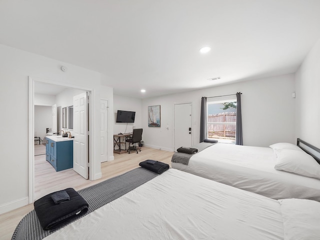 bedroom with light hardwood / wood-style flooring