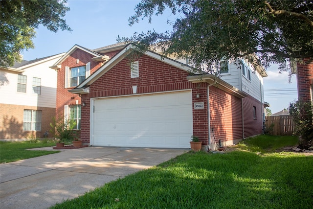 front of property featuring a front yard and a garage