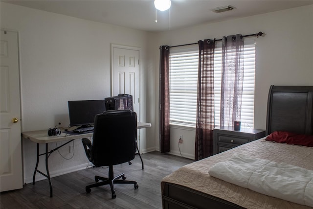 bedroom with hardwood / wood-style floors