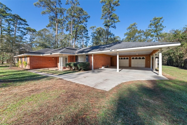 single story home featuring a front yard, a garage, and a carport