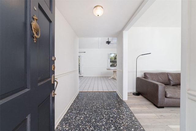 interior space with ceiling fan and hardwood / wood-style floors