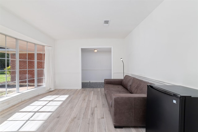 unfurnished living room featuring light wood-type flooring