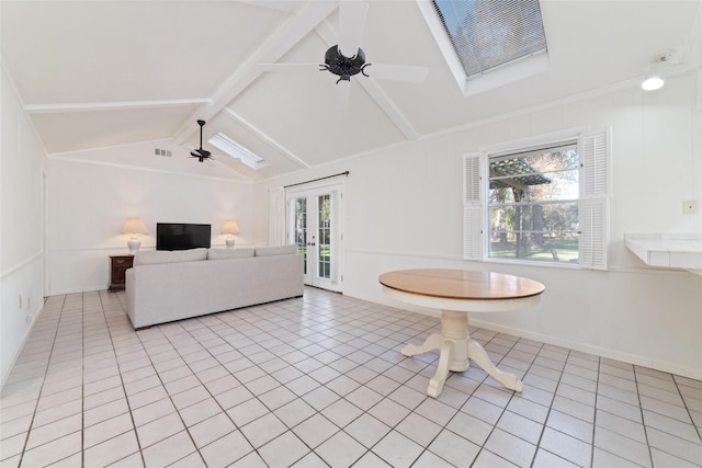 unfurnished living room featuring lofted ceiling with beams, ceiling fan, and light tile patterned floors