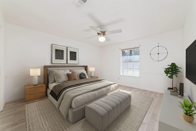 bedroom featuring light hardwood / wood-style flooring and ceiling fan