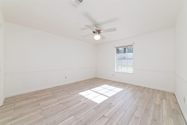 empty room featuring ceiling fan and light wood-type flooring