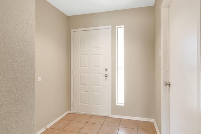 entrance foyer with light tile patterned flooring