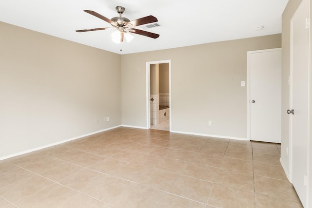 unfurnished room with ceiling fan and light tile patterned floors