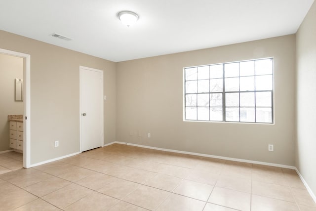 view of tiled spare room