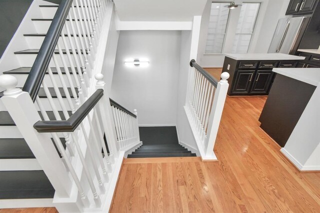 stairs featuring hardwood / wood-style flooring