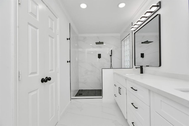 bathroom with tiled shower, vanity, and ornamental molding