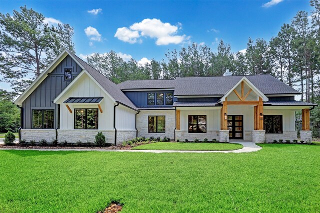 modern farmhouse with a front lawn