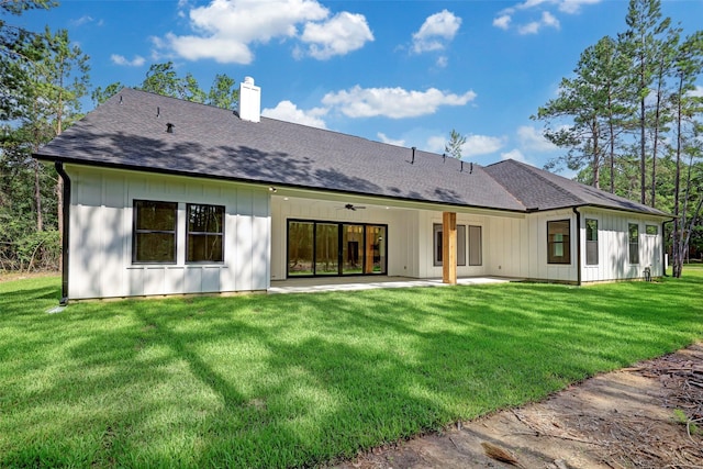 back of house featuring a patio, ceiling fan, and a yard