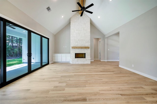 unfurnished living room featuring ceiling fan, light hardwood / wood-style flooring, high vaulted ceiling, and a fireplace