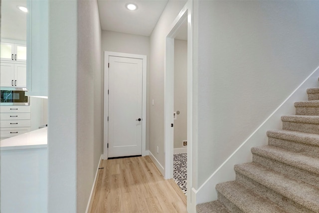 hallway with light wood-type flooring