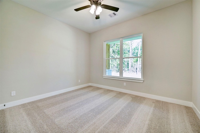 spare room featuring ceiling fan and carpet flooring