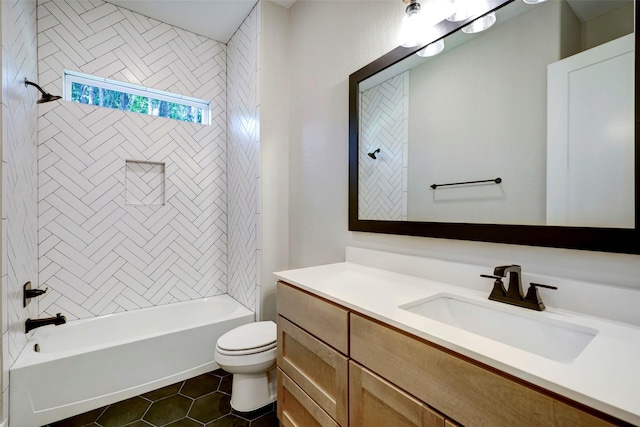 full bathroom featuring toilet, vanity, tile patterned floors, and tiled shower / bath combo