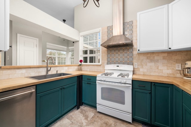 kitchen with sink, wooden counters, white gas range oven, stainless steel dishwasher, and wall chimney exhaust hood