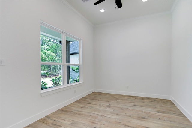 spare room with ceiling fan, ornamental molding, and light hardwood / wood-style flooring