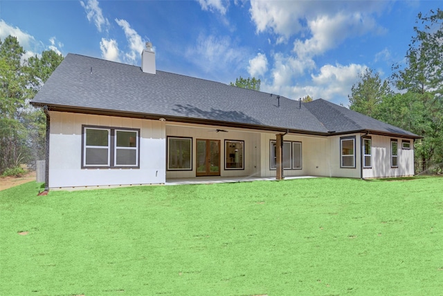 back of house featuring ceiling fan, a patio area, and a yard