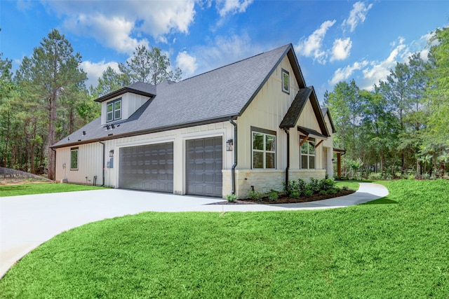 view of home's exterior featuring a garage and a yard