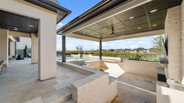 view of patio / terrace featuring ceiling fan