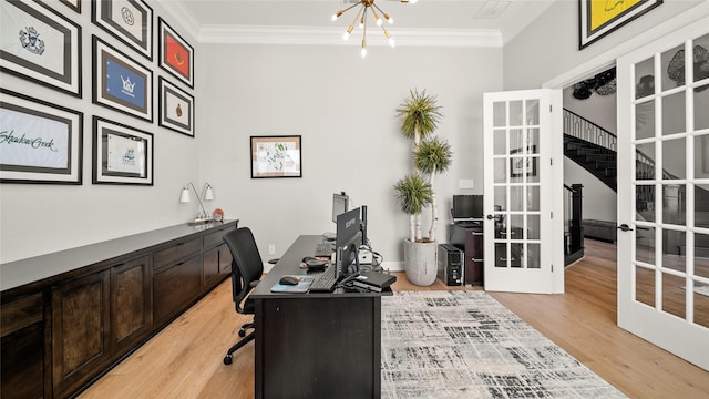 office space featuring a chandelier, light wood-type flooring, ornamental molding, and french doors