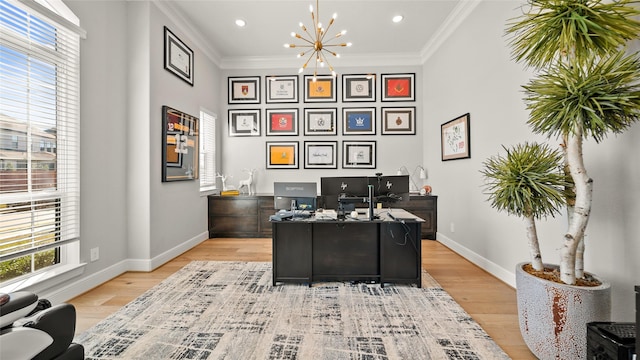 home office featuring crown molding, a chandelier, and light hardwood / wood-style floors