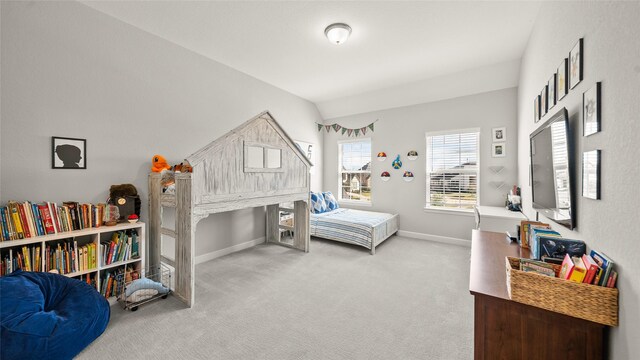 carpeted bedroom featuring lofted ceiling