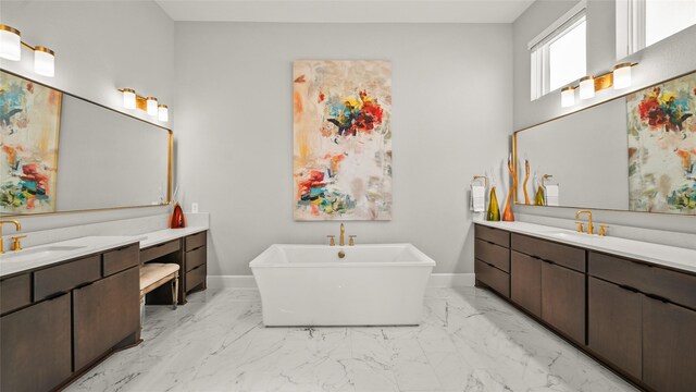 bathroom featuring vanity and a tub to relax in