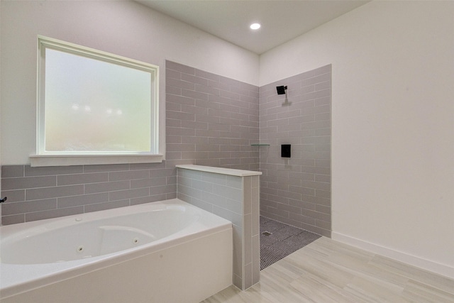 full bath featuring recessed lighting, wood finished floors, a whirlpool tub, baseboards, and a walk in shower