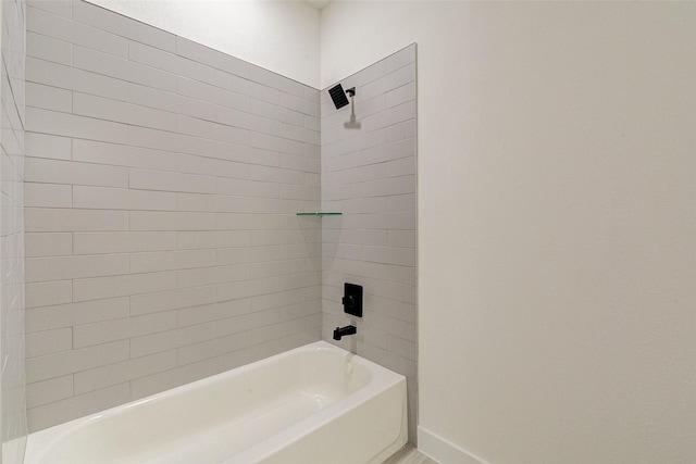 bathroom featuring shower / bathtub combination and baseboards