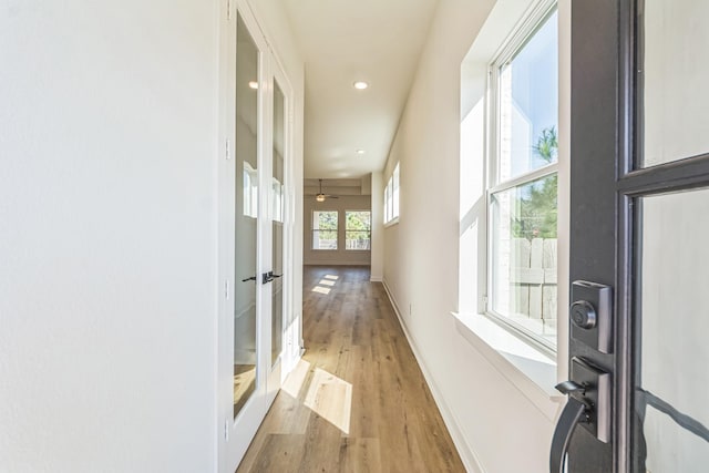 hallway featuring hardwood / wood-style flooring