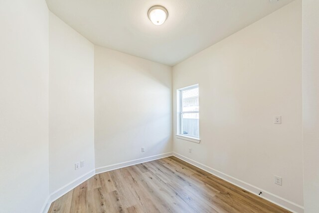 unfurnished room featuring light hardwood / wood-style flooring