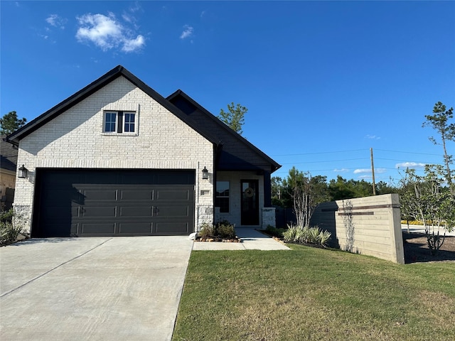 view of front facade with a garage and a front lawn