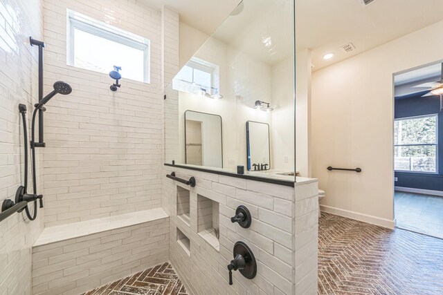 bathroom with a tile shower