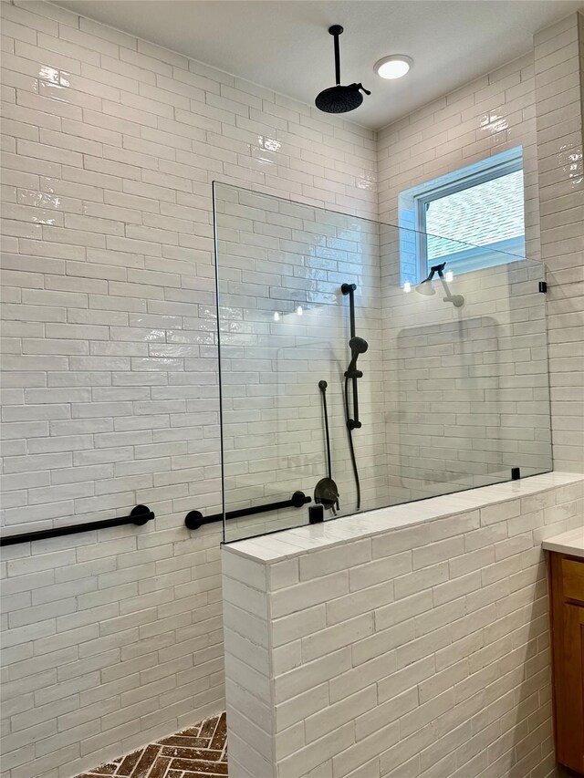 bathroom with a tile shower