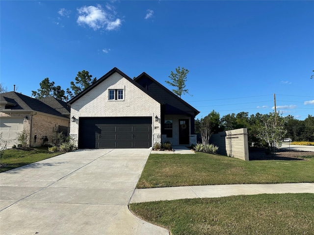 view of front of house with a garage and a front lawn