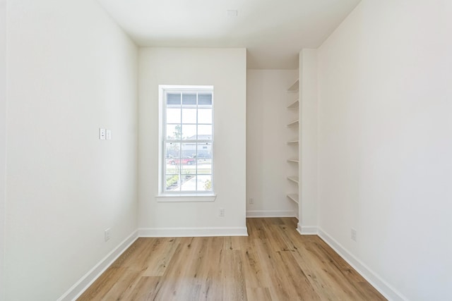 unfurnished room with light hardwood / wood-style flooring