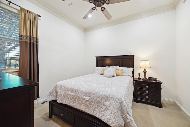 carpeted bedroom featuring ceiling fan and ornamental molding