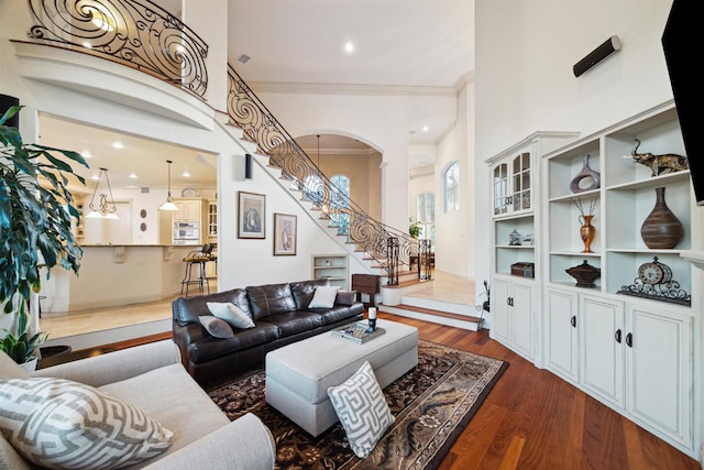 living room featuring crown molding and dark hardwood / wood-style floors