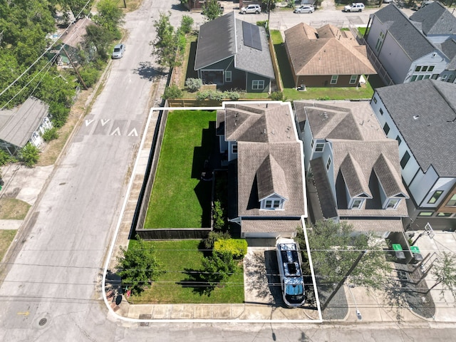 birds eye view of property with a residential view