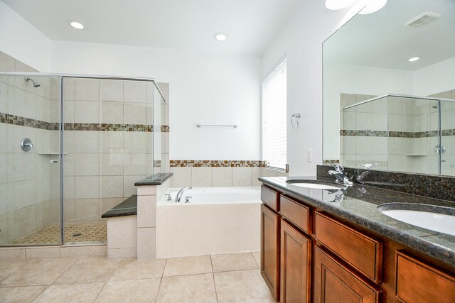 bathroom featuring tile patterned floors, vanity, and separate shower and tub