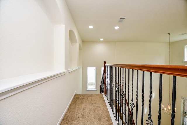 corridor featuring carpet flooring