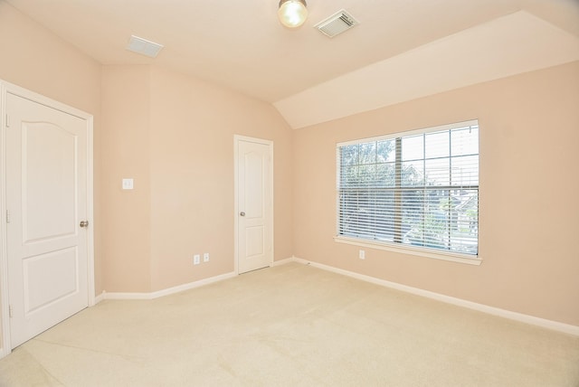 empty room featuring light colored carpet