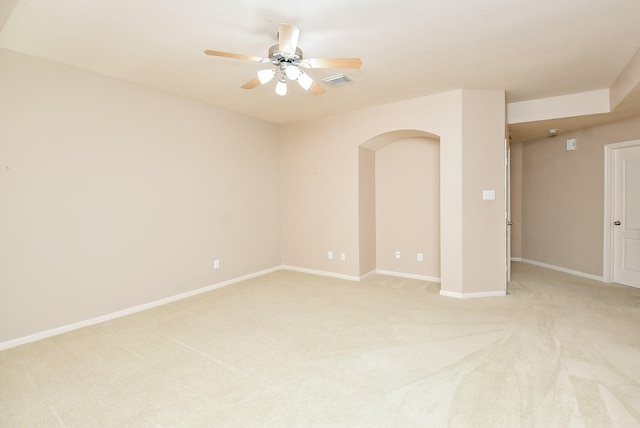 carpeted spare room with ceiling fan