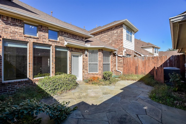 exterior space featuring a patio and central AC