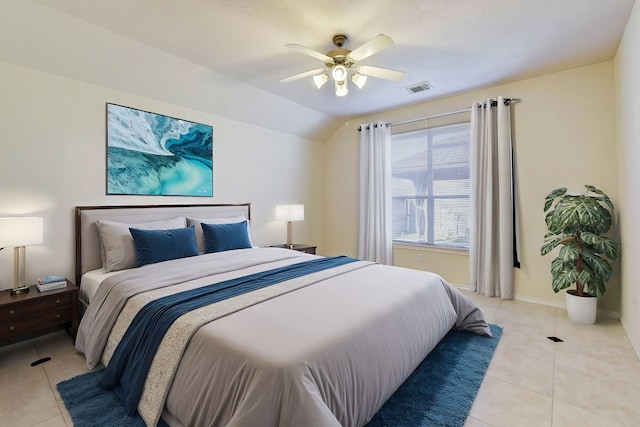 tiled bedroom with vaulted ceiling and ceiling fan